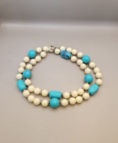 - Retro off white and turquoise plastic beaded necklace  - Round off white plastic beads with molded plastic turquoise blue beads - Silver tone costume metal accents  - 24 inch necklace  - Clean and in good condition  K 193 Vintage Blue Double Strand Jewelry, Vintage Blue Single Strand Necklace, Vintage Turquoise Single Strand Necklace, Vintage Blue Double Strand Necklaces, Vintage Adjustable Turquoise Beaded Necklace, Vintage Adjustable Turquoise Beaded Necklaces, Adjustable Vintage Turquoise Beaded Necklace, Vintage Turquoise Single Strand Beaded Necklace, Vintage Blue Beaded Turquoise Necklace