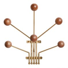 a brass chandelier with wooden balls hanging from it's sides and four arms