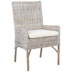 a wicker chair with white cushions