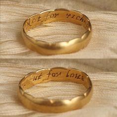 two gold rings with words written on them