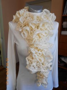 Milky white ruffle decorative scarf, hand knitted of ruffle acrilic yarn which brings a layered look. These textured waves look like the ruffles of a princess garment! This beautiful decorative lightweight wrap can be a nice part of any outfit. It also keeps you comfortable and warm. The scarf can be a nice Christmas gift for someone you love. Wonderful autumn wedding accessory. It is approximately 125cm/50inch in length and 10cm/4inch in width. I have other scarf options available in my store. White Shawl Scarves As Gift, White Crochet Scarf One Size, Handmade White Shawl As Gift, White Hand Knitted Shawl For Winter, White Crochet Shawl For Winter, White Hand-knitted Winter Shawl, White Hand Knitted Winter Shawl, Winter White Crochet Shawl, Handmade Cream Shawl For Winter