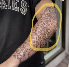 a man with a tattoo on his arm