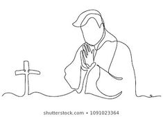 a person kneeling in front of a cross