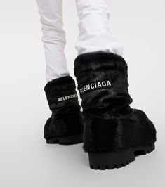 Find BALENCIAGA Alaska Faux Fur Snow Boots on Editorialist. Upper: fabric. Lining: fabric. Sole: leather insole, rubber sole. Toe shape: round toe. Made in Italy. Includes: shoe box, dust bag. Balenciaga Fur Boots, Black Fur Boots, Fur Boots Women, Fur Snow Boots, Fur Ankle Boots, Balenciaga Women, Designer Suits For Men, Balenciaga Black, Faux Fur Boots