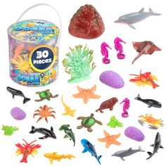 an assortment of sea life toys in a plastic container