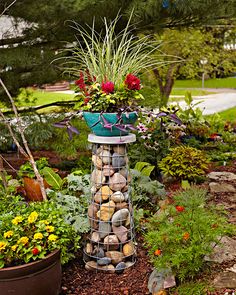 there is a tower made out of rocks in the garden