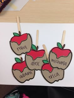 an apple themed card with two apples on them and the words reba, alex, adam, and enca