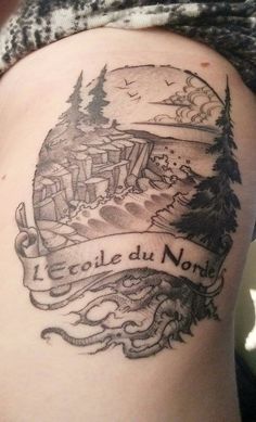 a woman's thigh with a tattoo that reads coole du monde on it