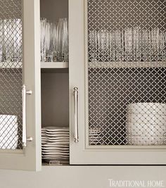 a cabinet filled with lots of dishes and silverware