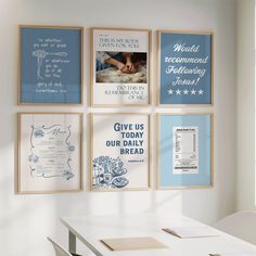 a white table with four framed pictures on it