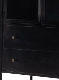 a black cabinet with three drawers and two doors