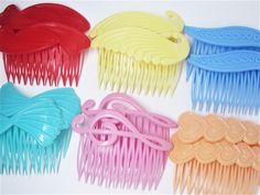 Choose your favorite colorful design! One (1) pair of never worn vintage 1980's pretty decorative hair combs made in Hong Kong. They are available in six colorful designs including red abstract hearts, yellow wings, blue dots, aqua bows, pink music clefts, and peach hearts. They are made of plastic with hard decorative tops and some flexibility to the tines. The split tines that sit close together tend to hold fine hair very well, while also working for thick hair. I tested these on a French Twist to hold up my finer shoulder length hair and they held very well, plus were light and comfortable. Perfect for when you want a pop of color in your hair and a cute gift for those that love vintage hair accessories. -Age: 1980's -Material(s): Plastic -Size: These range in size from 3-1/8" wide to Angel Wings Hair, Pink Music, Decorative Hair Combs, Heart Music, Bows Pink, Cute Valentines Day Gifts, Side Comb, Hair Comb Accessories, Comb Set