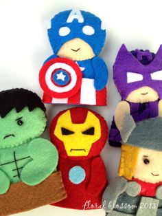 several stuffed toys are arranged in the shape of superheros