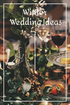 a table with wine glasses and flowers on it