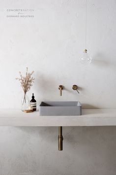 a bathroom sink sitting on top of a white counter