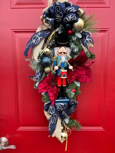 a nutcracker wreath on a red door