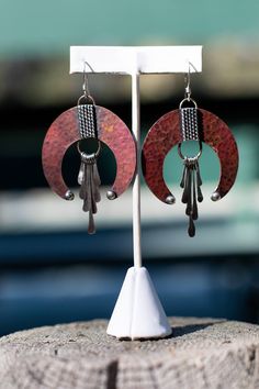 Details Compliment your favorite earth tone outfit with these hand-hammered, oxidized copper earrings featuring a sterling silver rope and hand-forged fringe accents, with small brass hoops. Each earring is handmade, one at a time by hand. Earwires are Sterling Silver Materials: Copper, Sterling Silver, and Brass Care instructions: These earrings are sealed with Renaissance Wax which protects them for a time, but because of the nature of copper, these earrings will need to be maintained with a J Soldered Earrings, Copper Earrings Handmade, Lapidary Jewelry, Nice Earrings, Desert Moon, Hammered Copper Earrings, Copper Work, Hammered Jewelry, Metal Jewellery