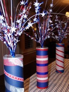 three patriotic vases with red, white and blue decorations