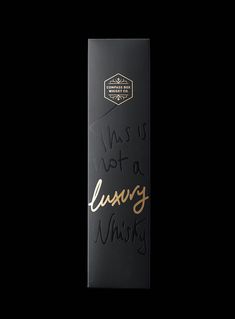 this is not a luxury whinery bottle in black with gold lettering on it