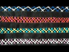 several different colored lines on black fabric