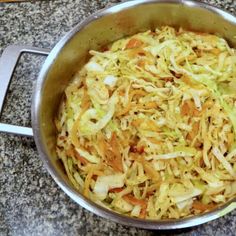 a pan filled with food sitting on top of a counter