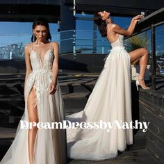 two beautiful women in white dresses posing for the camera with their legs spread out and one woman