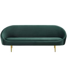 a green velvet couch with gold legs