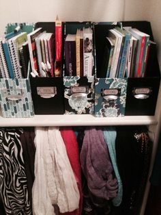 an organized closet with clothes and books