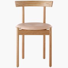 a wooden chair with a cushion on the seat and backrest, against a white background