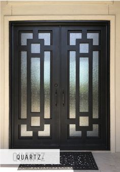 a black double door with glass panels on it