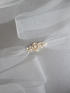 "This delicate bridal belt is made with the Premium Quality European Crystal and pearls. The crystal design measures 1 1/8\" wide and 2 7/8\" long. Finished with 3\" wide tulle ribbon. The entire sash measures 150\" long. Available in gold, rose gold or silver finish." Bridal Belt Diy, Bride Belt, Gold Sash, Bridesmaid Belt, Bridal Belts, Tulle Ribbon, Contemporary Bridal, Bridal Sash Belt, Wedding Belt