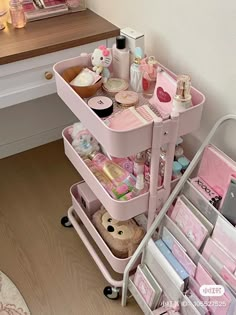 a pink cart filled with lots of different items