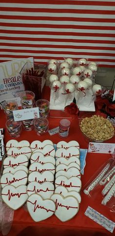 the table is set up with cookies, candy and other items for medical care purposes