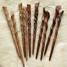 five different types of wood carving tools laid out on a table