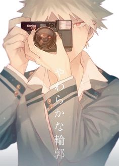 an anime character holding up a camera to his face