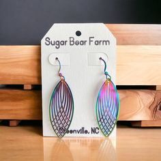 These stainless steel filigree style drop earrings are multicolored and change color depending on the angle of the light. I attached them to matching fishhook earrings and they are SO beautiful! Approximately 1.6 inches long and .6 inches wide. Rainbow Metal Earrings With Ear Wire, Rainbow Metal Drop Earrings, Rainbow Metal Earrings, Multicolor Metal Earrings With Ear Wire, Multicolor Metal Ear Wire Earrings, Fishhook Earrings, Sugar Bears, The Angle, Fish Hook Earrings