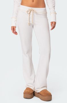 Throw it back to Y2K style with these low-rise sweatpants crafted from an ultracomfy cotton blend and styled with minimal seam detailing. Drawstring waist 50% cotton, 50% polyester Machine wash, dry flat Imported Low Rise Sweatpants, Trendy Outfit Inspo, Chic Romper, Stylish Summer Outfits, Cute Pants, Cute Everyday Outfits, Womens Loungewear, Cozy Fashion, Dream Clothes