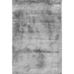 an animal fur rug is shown in black and white, as well as the background