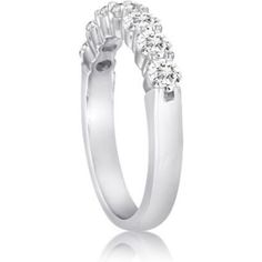 a white gold ring with five diamonds