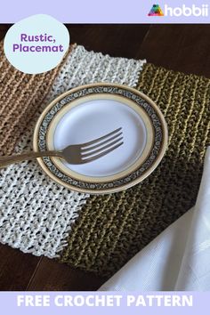 a plate with a fork on it sitting next to a place mat