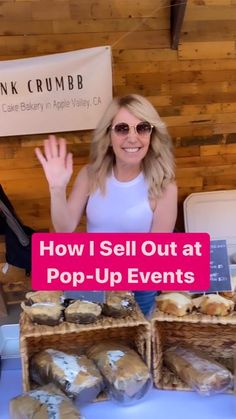 a woman standing in front of a table filled with bread and pastries that reads how i sell out at pop - up events