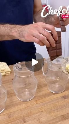 a man is making chocolate in three pitchers