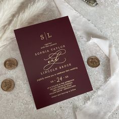 the wedding suite is laid out on top of a white blanket and some gold coins