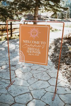 a welcome sign for the hen party in front of a fenced area with trees