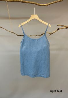 "Adorable camisole top by Nature Chic. 100% linen construction, this slip top is simply the best. Relaxed fit, straight cut, adjustable spaghetti straps, and classic scoop neckline, all these elements work together to create a versatile essential top. It is not only good for summer but also nice for fall underneath a shirt or jacket. -Prewashed linen -Straight cut but roomy -Scoop neck ( V neck's listing is below): https://www.etsy.com/listing/892733834/made-to-order-linen-camisole-top-v-neck?re Summer Scoop Neck Camisole With Built-in Bra, Summer Camisole With Built-in Bra And Scoop Neck, Fitted Linen Tank Top For Everyday, Solid Linen Sleeveless Tank Top, Sleeveless Linen Tank Top, Solid Color Linen Sleeveless Tank Top, Solid Camisole Tank Top For Vacation, Solid Color Camisole Tank Top For Vacation, Solid Cotton Camisole For Beach