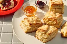 scones on a plate with jam and jelly