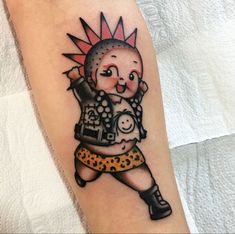 a person with a tattoo on their arm that has an image of a cartoon character