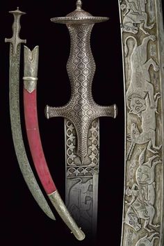 two swords are displayed in an intricately designed display case, one is red and the other is silver