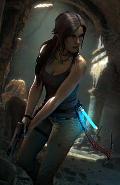 a woman holding a light saber in her right hand while standing next to a cave