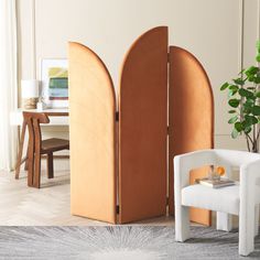 a room divider in the shape of an arch with a chair next to it